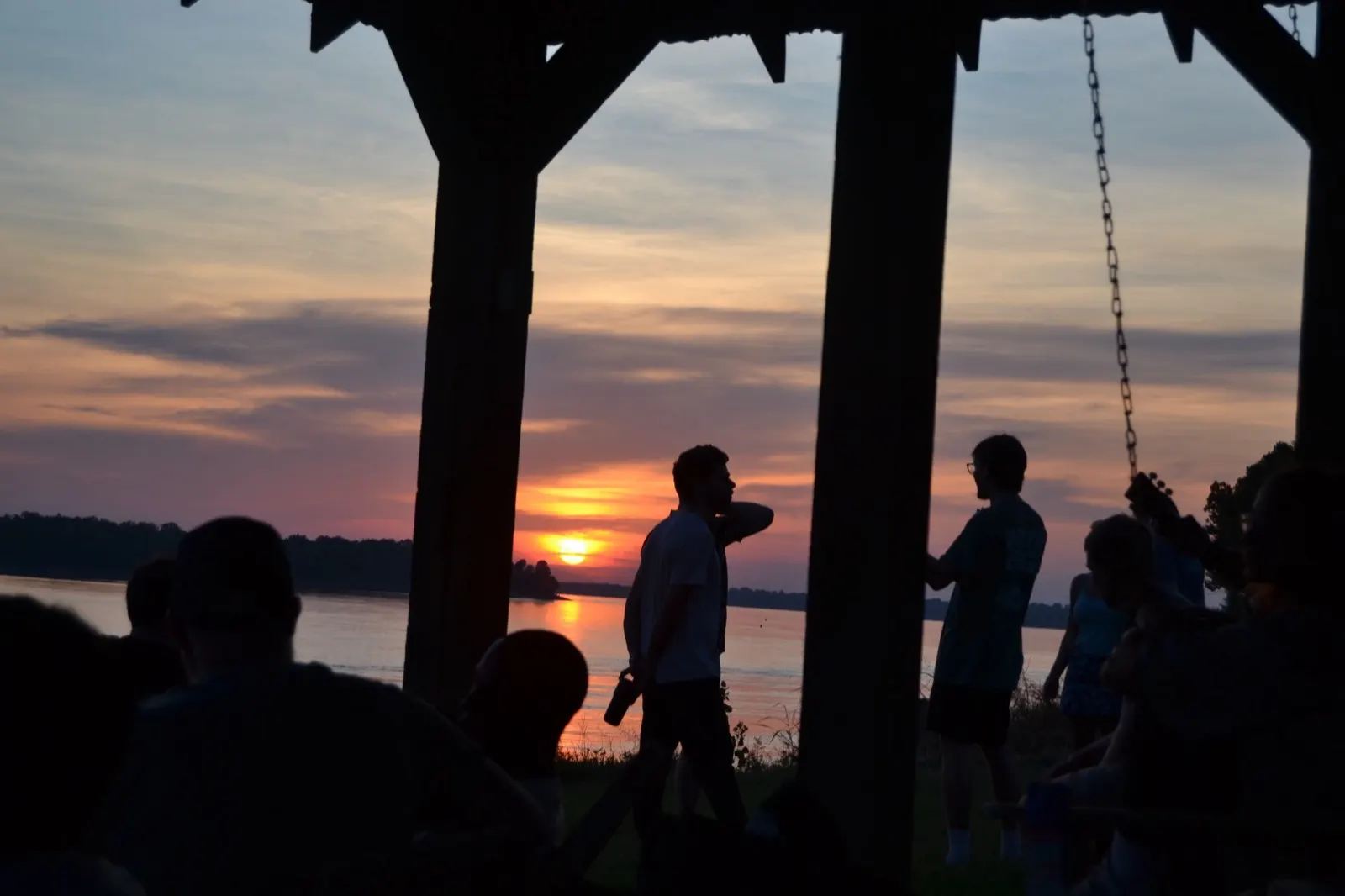 Gathered at the blacksmith shop as the sun goes down