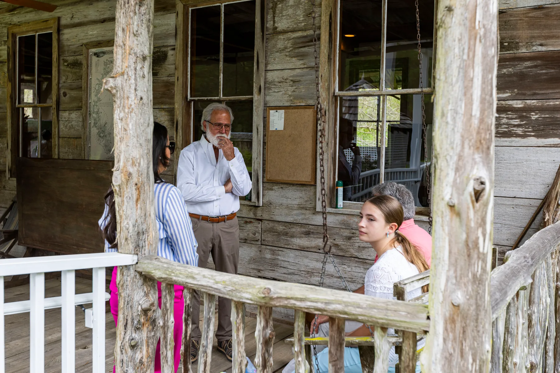 Conversation on a weathered cabin porch