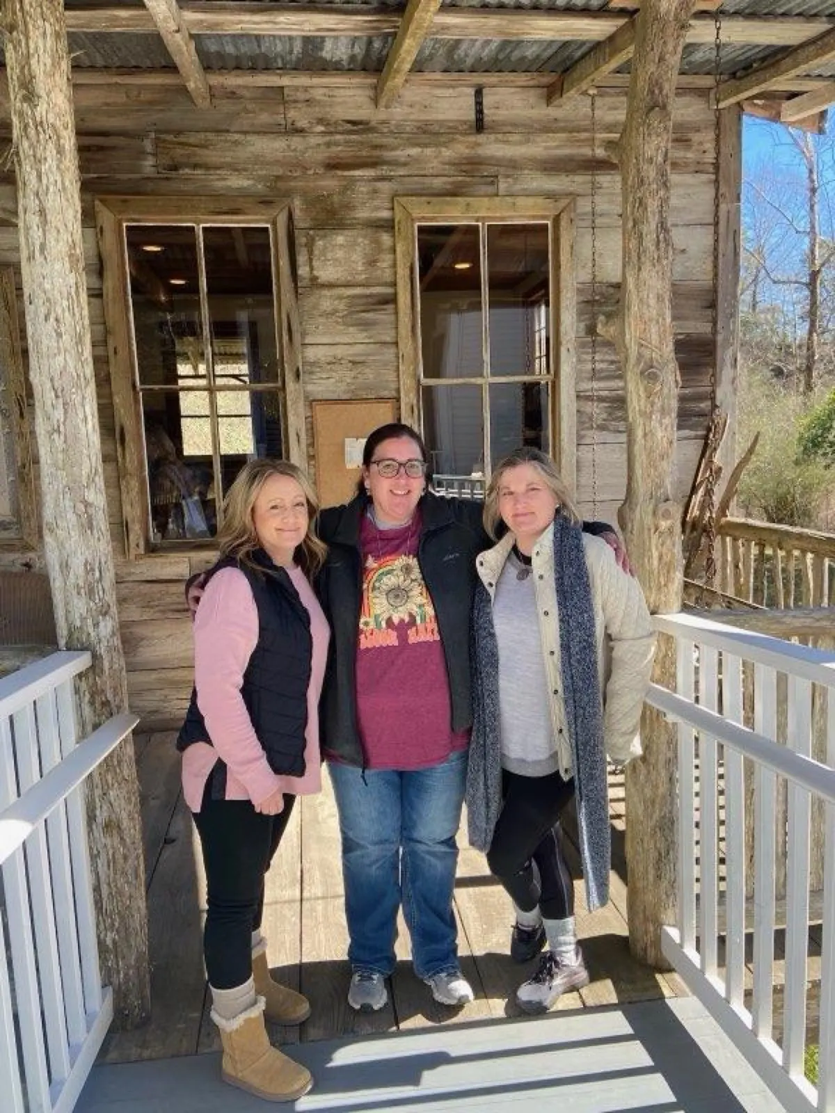 Friends on a cabin porch