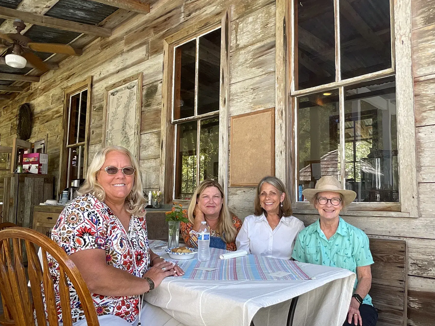 Guests sharing a table on the cabin porch