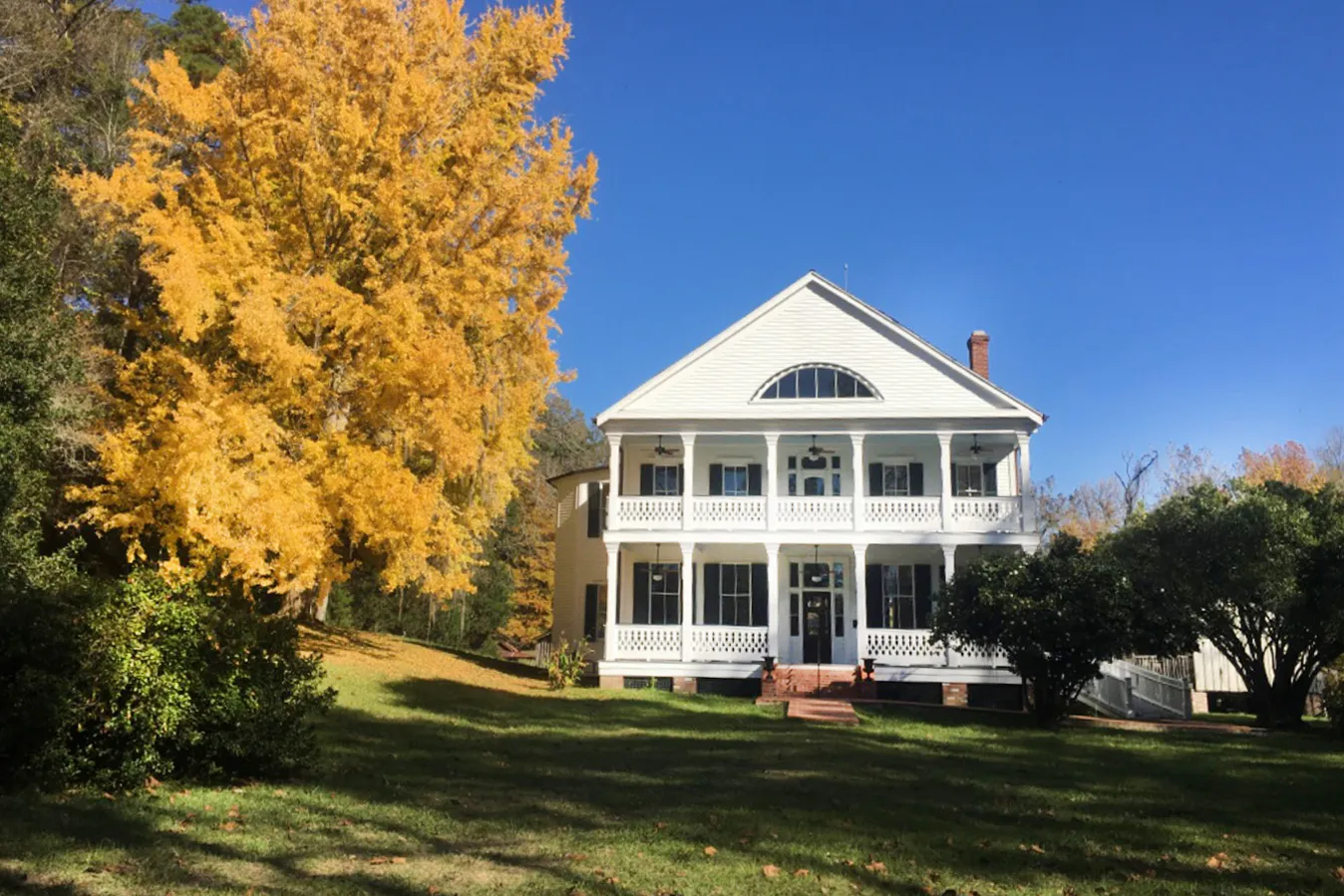 The home framed by autumn color