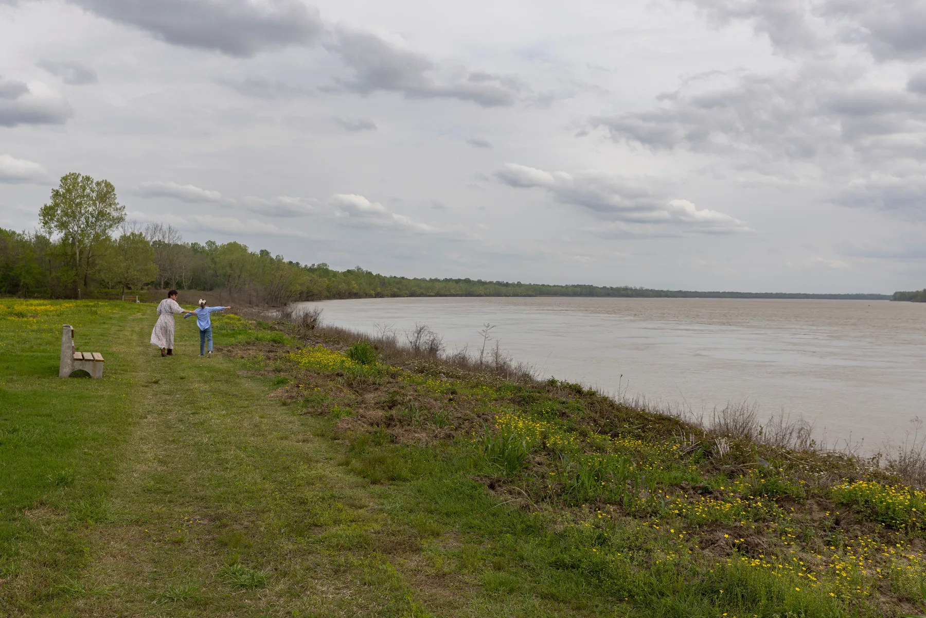 Walking the mown path along the river bluff