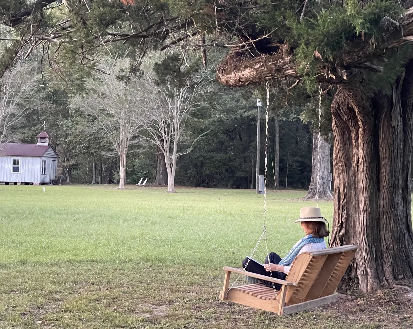 Resting on the swing, the chapel across the lawn